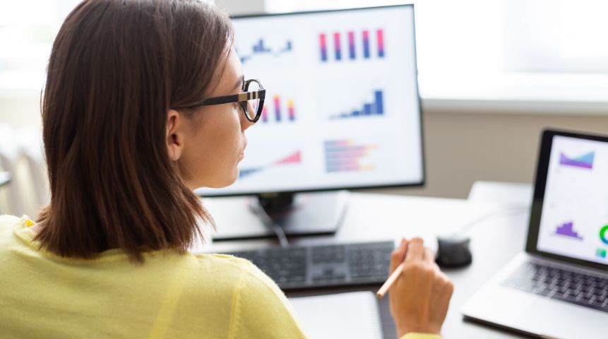 A woman looking at a computer screen