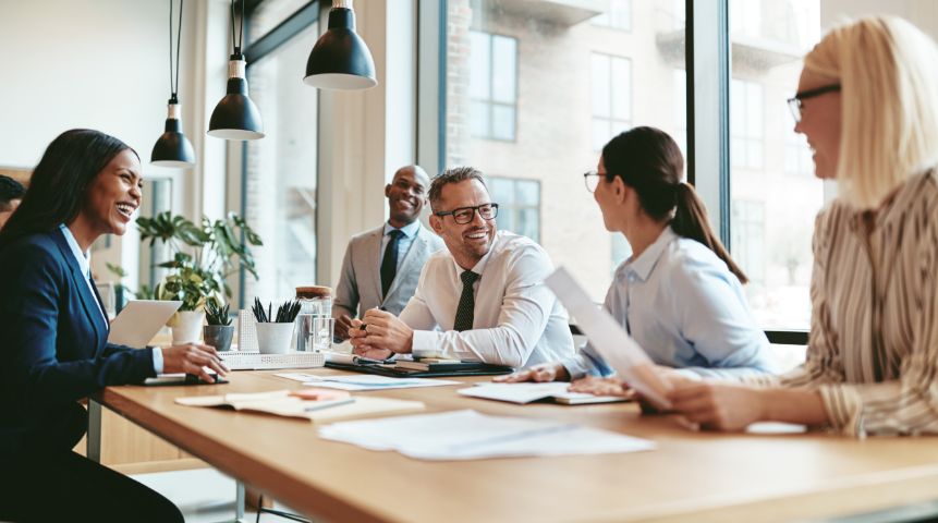 A group of business people laughing