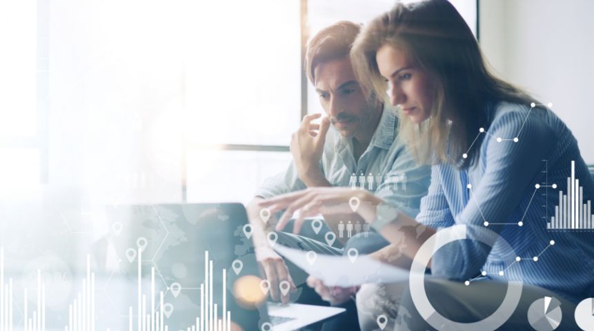 A man and a woman looking at a computer screen